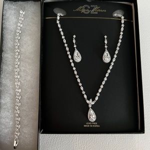 Brand new never worn necklace, bracelet, and earrings